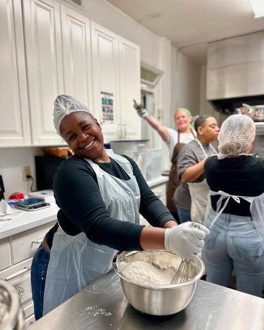Participants baking together in a community kitchen.